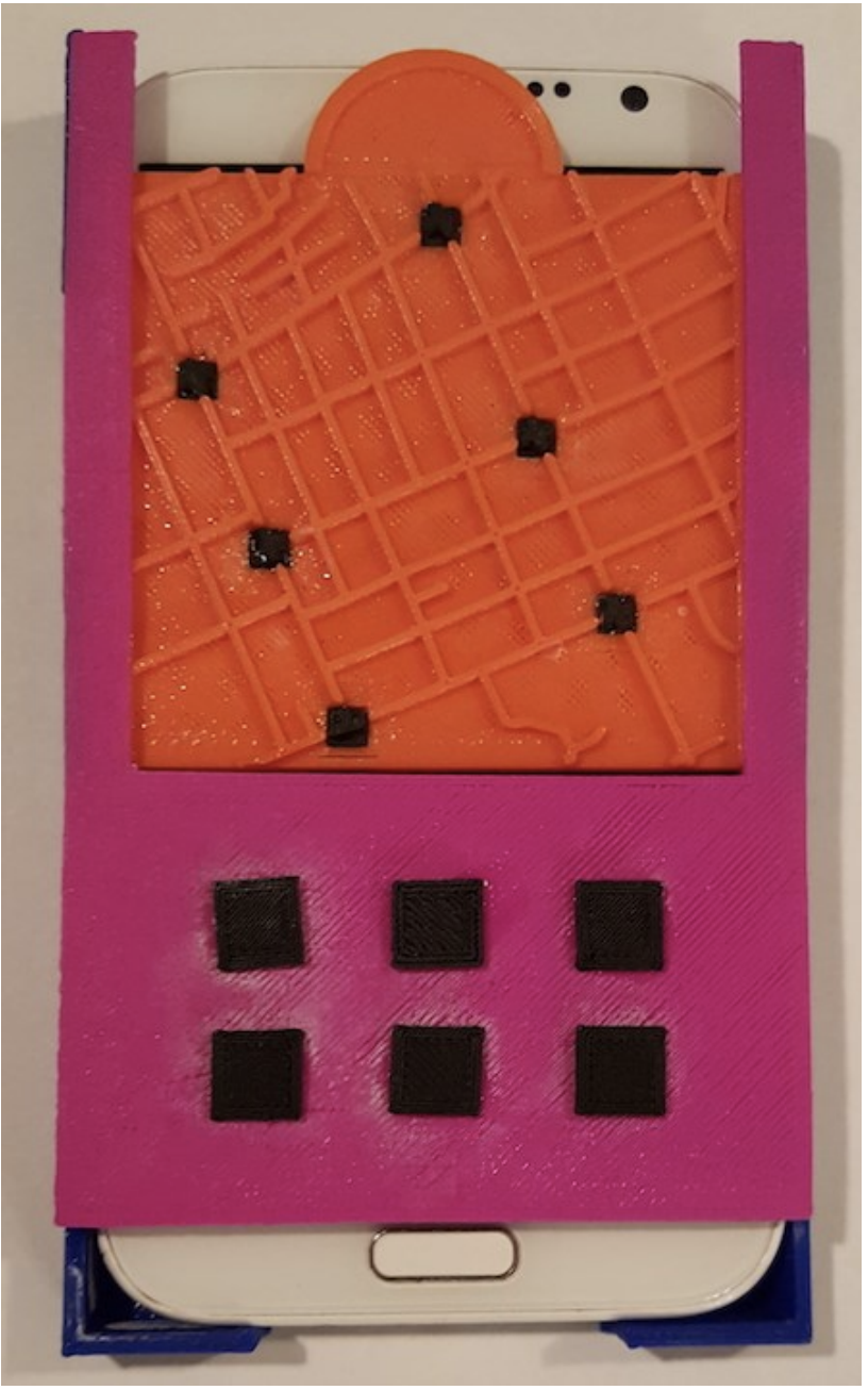 :img An interactive map with 6 black conductive touchpoints. The map is held in a case with 6 conductive buttons that houses a Samsung Note 2 with a 5.5-inch screen., 40%